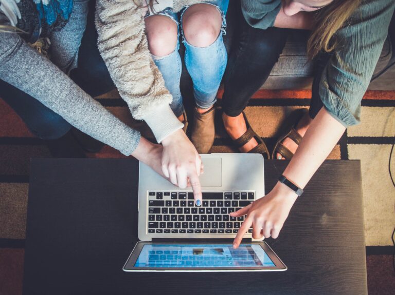 Students pointing at a screen