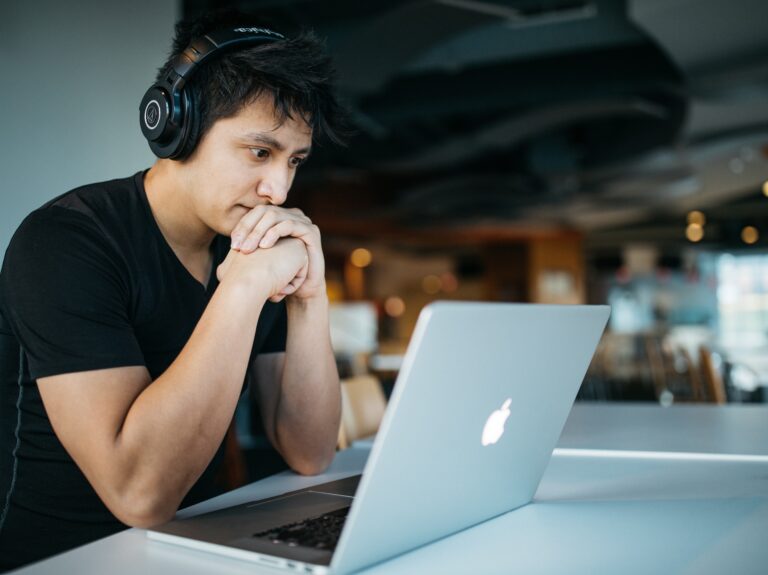 A student focusing on their laptop