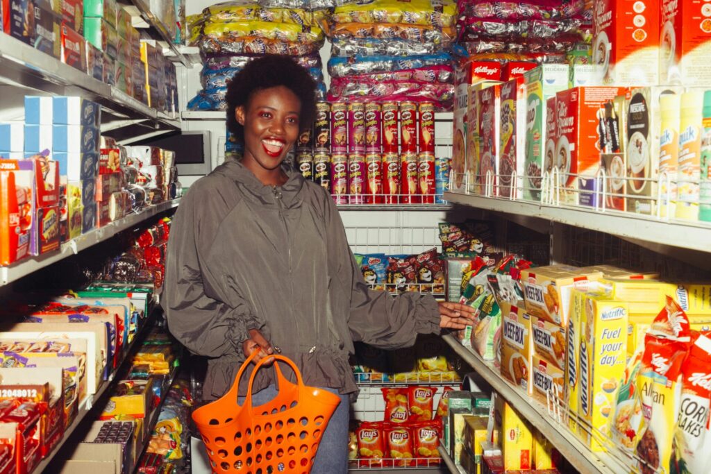 A young woman shops the grocery isle 