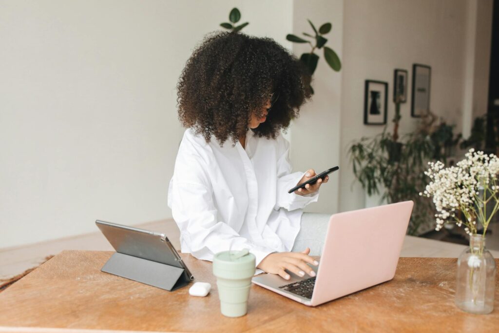 A woman uses multiple devices at once 