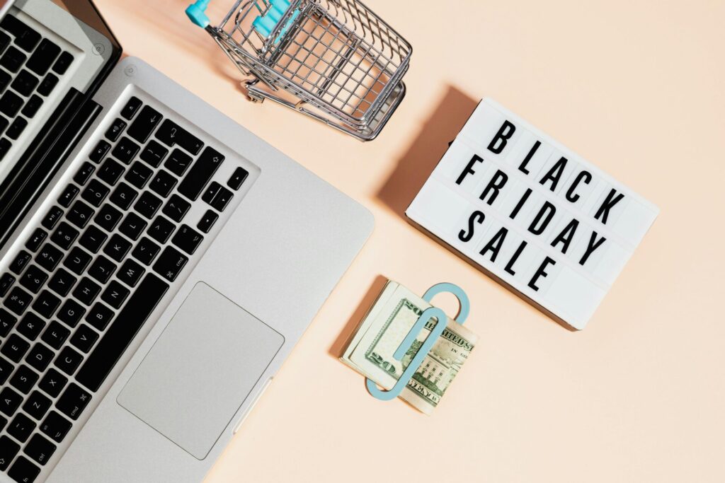 Laptop flat lay with "Black Friday Sale" graphic