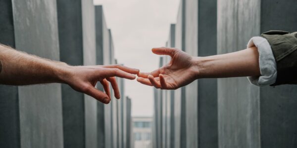 Two hand reaching out for eachother